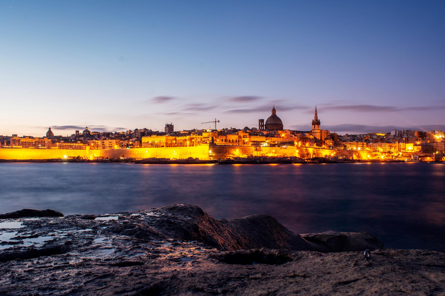 a view of valletta at night